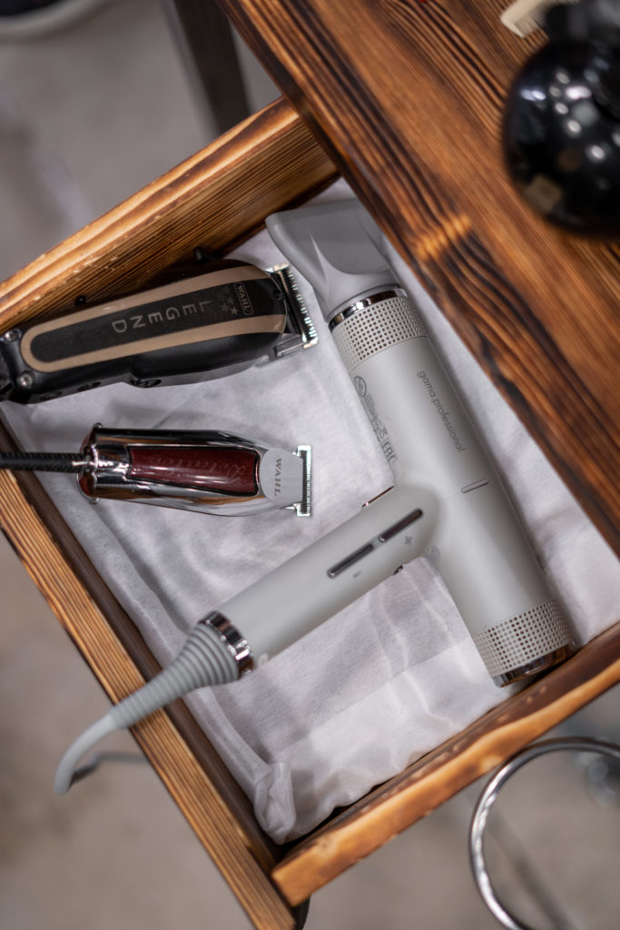 Canva - Barber Tools in a Wooden Drawer